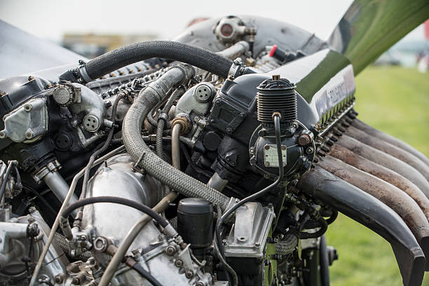 Rolls Royce Merlin aero engine Abingdon air show UK May 4, 2014: Rolls Royce Merlin aero engine. V12 27 litre powerplant of numerous World War 2 aircraft and renowned in British Spitfire fighter amongst others. Seen as working display. falco columbarius stock pictures, royalty-free photos & images