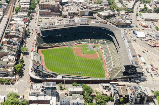 Chicago, Illinois, USA - July 12, 2013: Aerial view of the Wrigley Field stadium in chicago. This arena is the house of the Chicago Cubs baseball team. The stadium is situated on the North East downtown of Chicago. The image has been taken from an Helicopter .