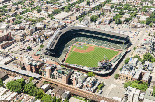 Chicago, Illinois, USA - July 12, 2013: Aerial view of the Wrigley Field stadium in chicago. This arena is the house of the Chicago Cubs baseball team. The stadium is situated on the North East downtown of Chicago. The image has been taken from an Helicopter .