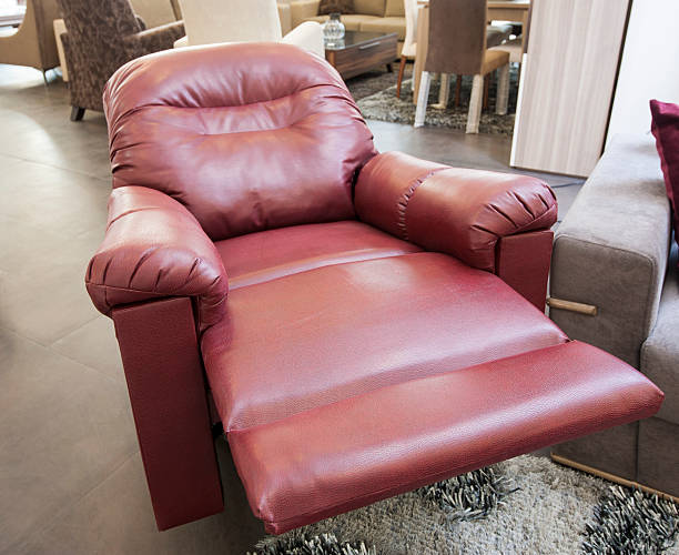Red leather armchair in show room stock photo