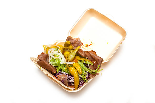 Lamb Doner kebab isolated on a white studio background.Lamb Doner kebab isolated on a white studio background.