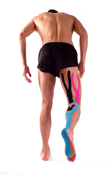 istock Kinesiology tape on hamstring and on calf. Physiotherapy for athlete 492413328