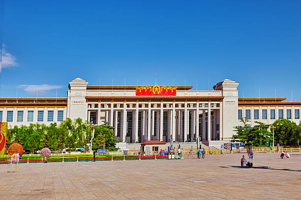 Beijing, Tiananmen Square Beijing, China - May 19, 2015: People,  citizens of Beijing, walk on Tiananmen Square - the largest square in the world, Beijing. National Museum of China. China. forbidden city beijing architecture chinese ethnicity stock pictures, royalty-free photos & images