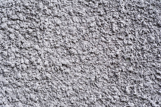 istock Texture of old wall covered with gray stucco 492416450