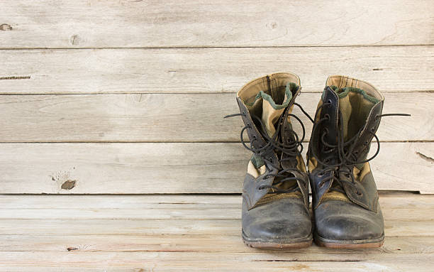 istock military boots on wood 492416460