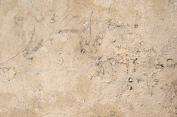 istock Texture of old wall covered with gray stucco 492417050