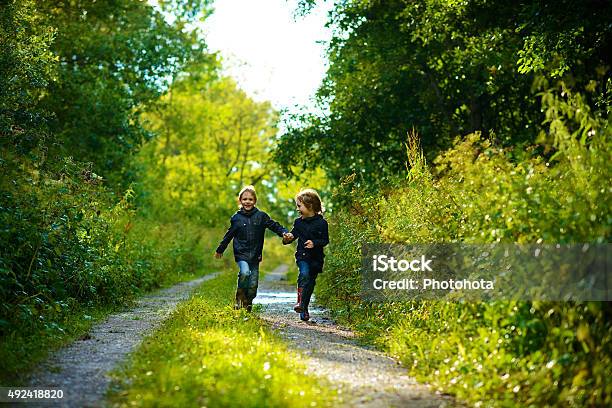 Boys In Summer Forest After Rain Stock Photo - Download Image Now - 2015, Activity, Beauty In Nature