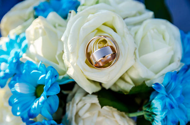 istock Wedding rings on the bouqet 492419040