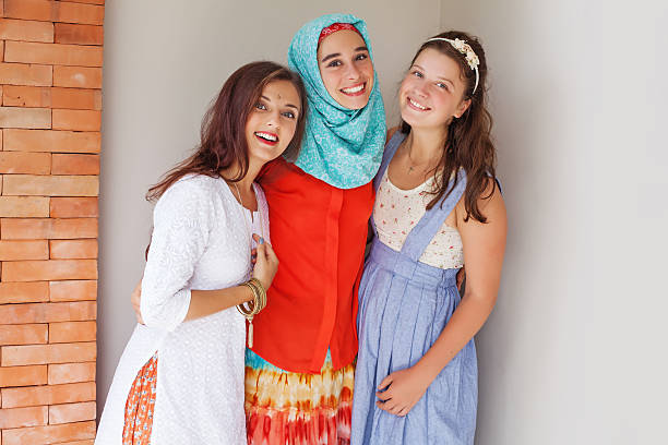 istock three young friends of different religions 492419922