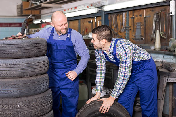 istock Mounting specialists in coveralls working 492420184