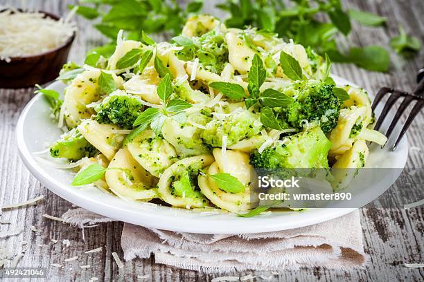 Homemade Pasta Orecchiette With Broccoli Parmesan Cheese And Basil Stock Photo - Download Image Now