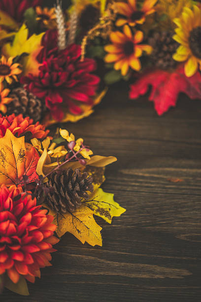 istock Fall themed decorations forming border on wooden background. Thanksgiving celebrations. 492421084