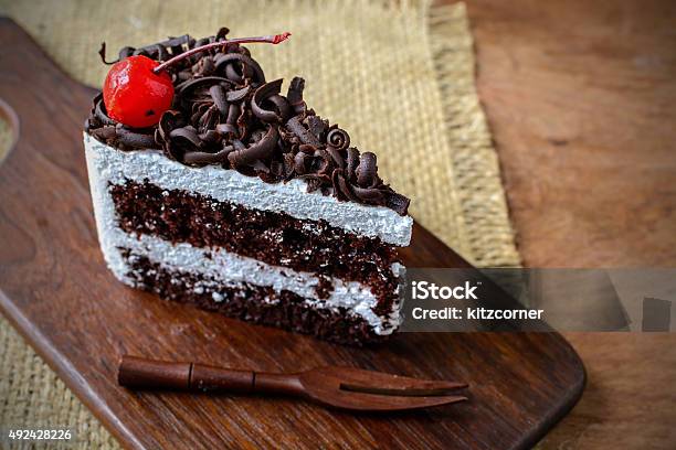 Black Forest Chocolate Cake On Wooden Table Stock Photo - Download Image Now - Black Forest Cake, Slice of Food, 2015