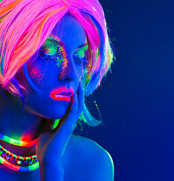 istock Women Portrait in Ultraviolet Light 492441025