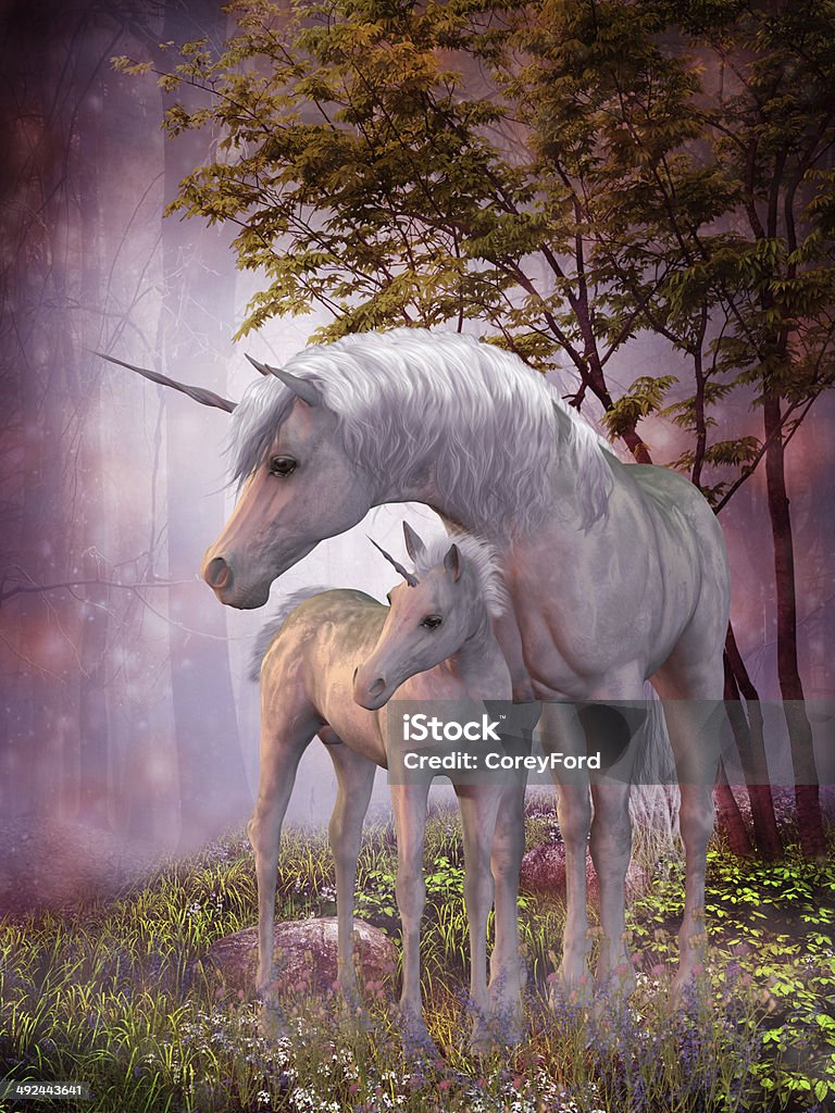 Unicorn Mare and Foal A white unicorn doe and fawn spend their peaceful time together in the magical forest. Unicorn Stock Photo