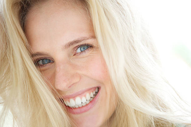 istock Cheerful young blond woman smiling 492443847