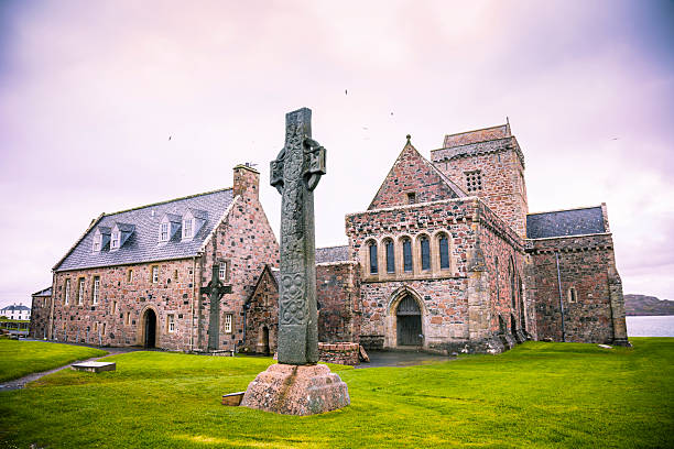 Iona Abbey Iona Abbey, founded by St Columba in AD 563 on the tiny island of Iona just off the Isle of Mull in Western Scotland. celtic cross iona abbey scotland stock pictures, royalty-free photos & images