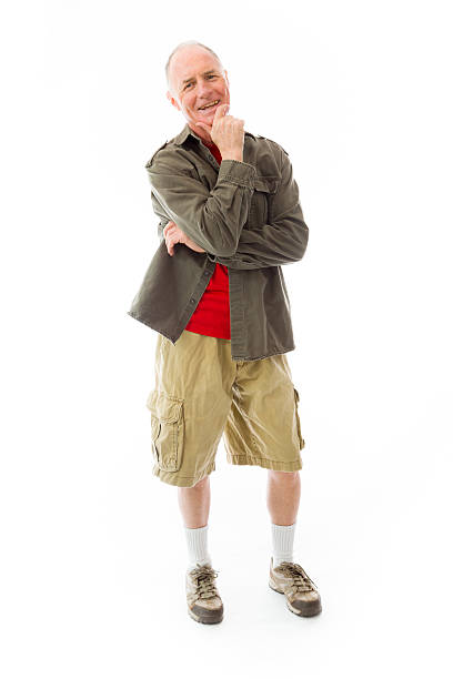 istock Senior man standing with hand on chin 492445761