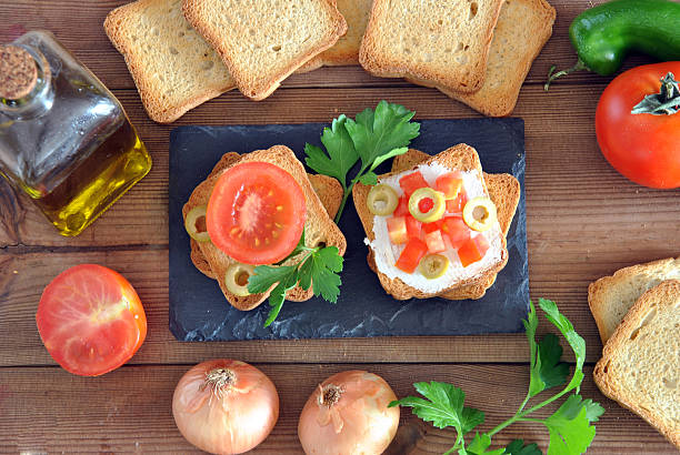 istock toast with tomato, oil, green olives 492446331