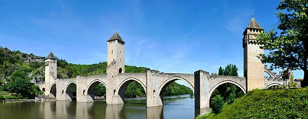 The historic XIV century Pont Valentre fortified bridgen crossing the Lot River to the west of Cahors, in France. It has become a symbol of the city.It was built between 1308 and 1378 with six Gothic arches and three square towers.