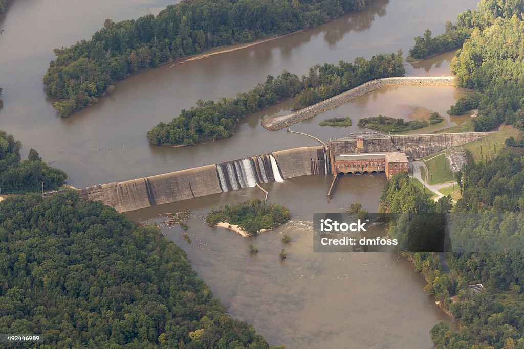 Old hydroelectric dam on a river Older, small hydroelectric dam on a river - aerial view Aerial View Stock Photo