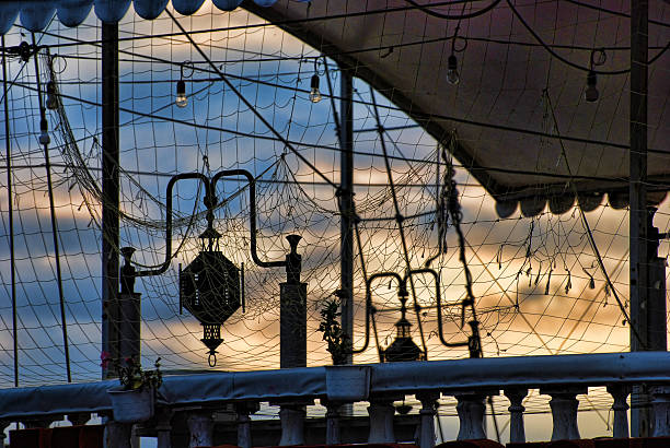 istock Fishing Nets on a Yacht at the Evening Clouds Background 492450292