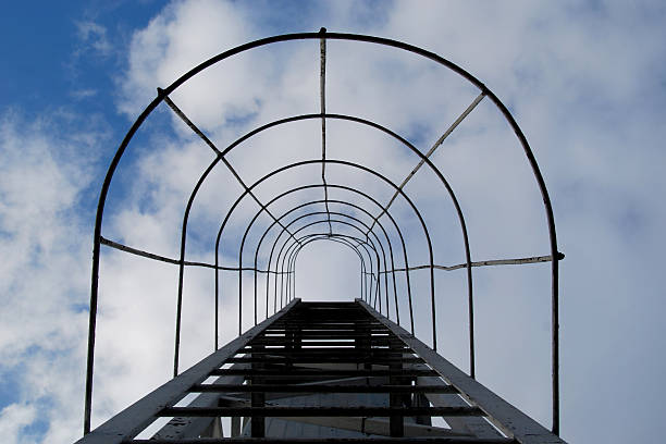 istock Stairway to Heaven. Fire Escape on the Clouds Background 492451922