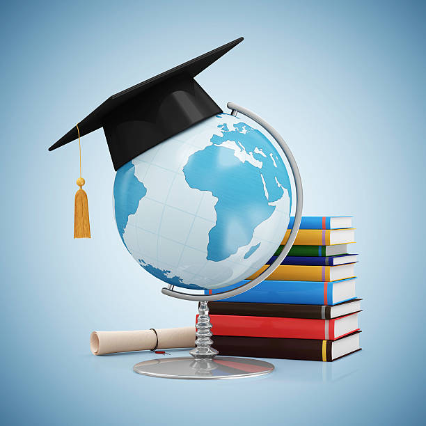 istock Desk Globe with Graduation Cap, Diploma and Books 492454256