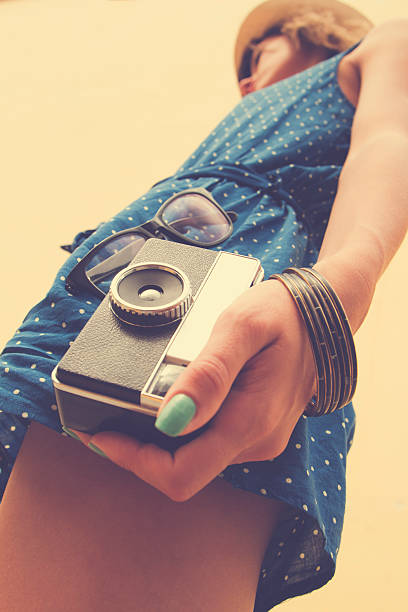istock Hipster girl with old camera. 492454550