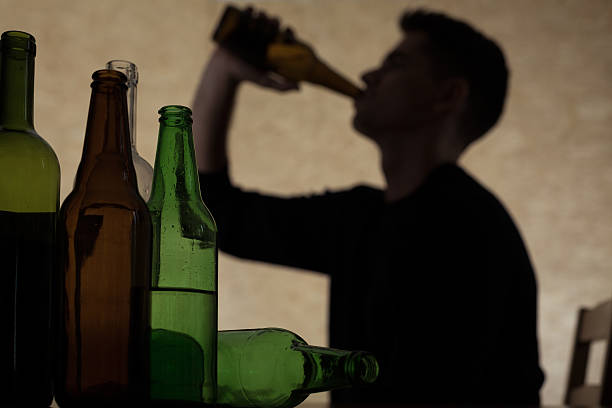 Teenager drinking beer stock photo