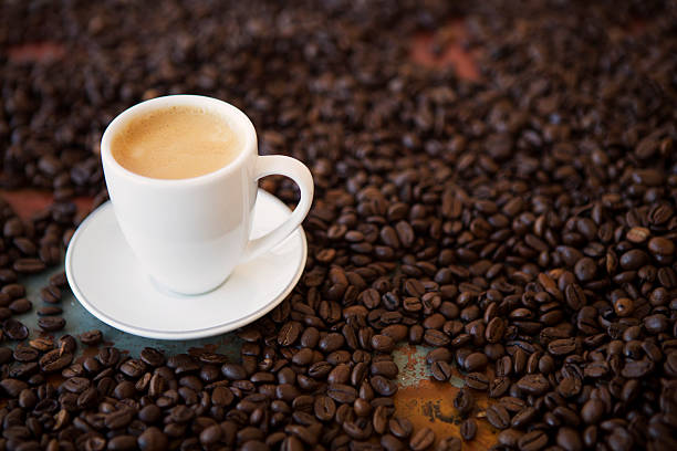 istock cup of coffee and beans on table 492457992