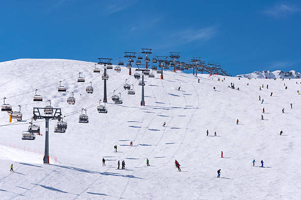 Skiers and chairlifts in Solden, Austria stock photo