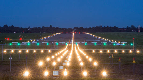 airport takeoff and landing area at evening airport takeoff and landing area at evening, in Hannover, Germany airfield stock pictures, royalty-free photos & images