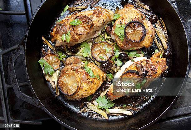 Roasted Chicken With Lemon Slices On The Stovetop Stock Photo - Download Image Now - Chicken Meat, Recipe, Directly Above