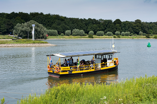 Driel, Netherlands - August 1, 2015: drielse veer, Pedestrian and bicycle ferry between Driel an Doorwerth across the nether Rhine runs for 90% on solar power in the summermonths