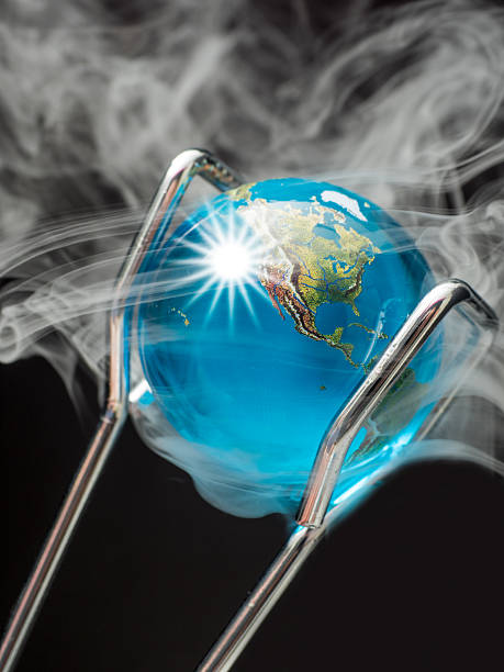 istock Steaming Planet Earth Held by Tongs Illustrating Global Warming. 492464882