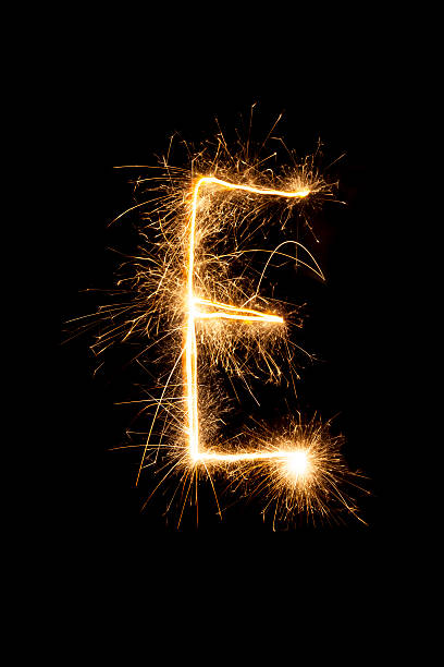 Sparkling letter ,, E " Sparkling letter ,, E " on a pure black background. Can be used for birthdays or anniversaries. fire letter e stock pictures, royalty-free photos & images