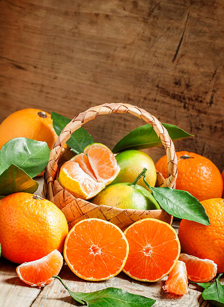 istock Cut ripe juicy orange tangerines 492483850