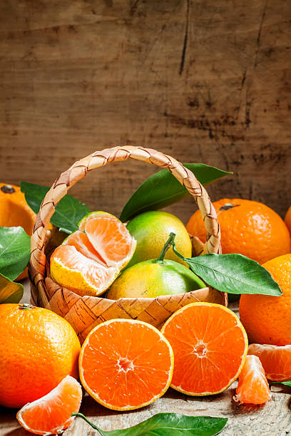 istock Cut ripe juicy orange tangerines 492484012