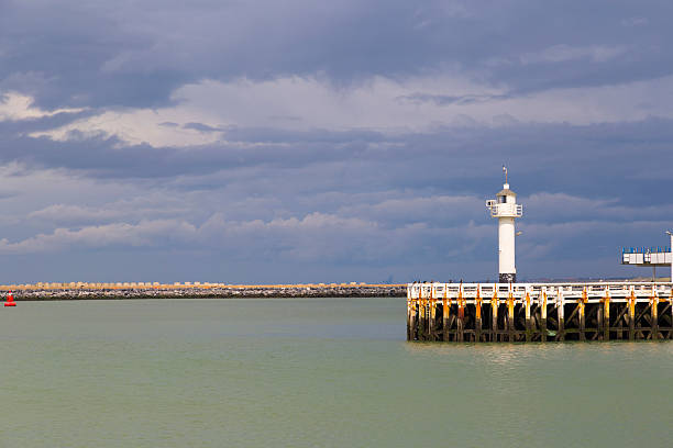 istock Lighthouse against stormy sky in Ostend, Belgium 492485938