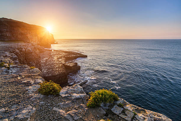 istock Stunning coastal landscape with long exposure waves crashing at 492486298