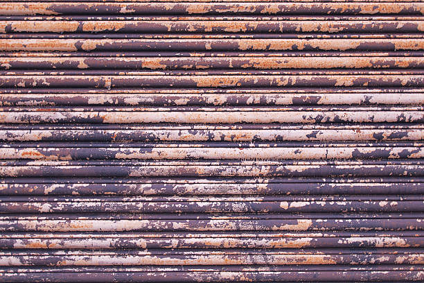 istock Rusty textured metal roller door with peeling white paint 492486728