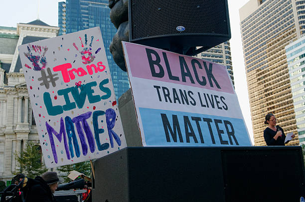 Philly Trans* March Philadelphia, PA, USA - October 10, 2015; Signs at Thomas Paine Plaza allude to transgender victims of violence, most of them trans women of color. Participants in the 5th annual Philly Trans* March gather in Center City, Philadelphia Pa, on Saturday October 10, 2015. The event was themed 'Rebuild the Unity in our Community' and is held in support of the transgender community. (photo by Bastiaan Slabbers) transgender protest stock pictures, royalty-free photos & images