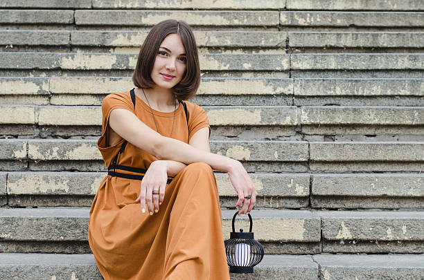 istock Beautiful girl sitting on stairs 492490936