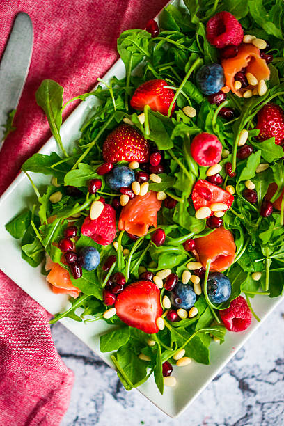 istock Healthy salad with arugula,spinach,smoked salmon and berries 492492052