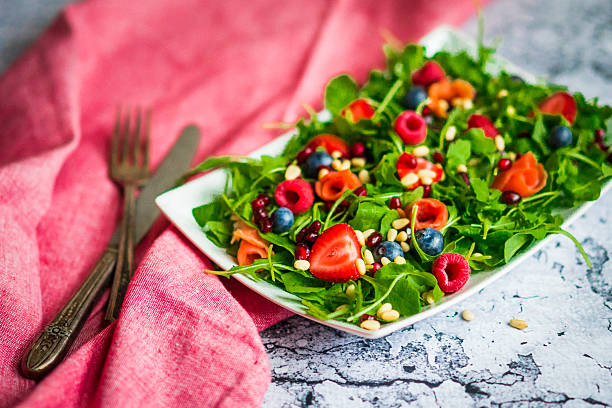 istock Healthy salad with arugula,spinach,smoked salmon and berries 492492068