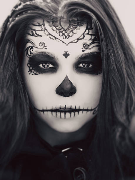 istock Beautiful woman with halloween sugar skull make-up 492493004