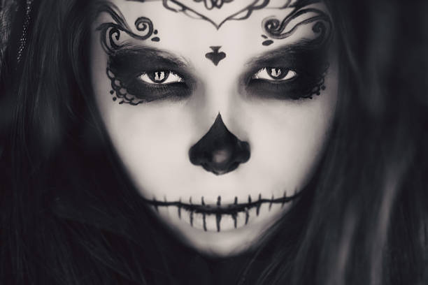 istock Beautiful woman with halloween sugar skull make-up 492493018