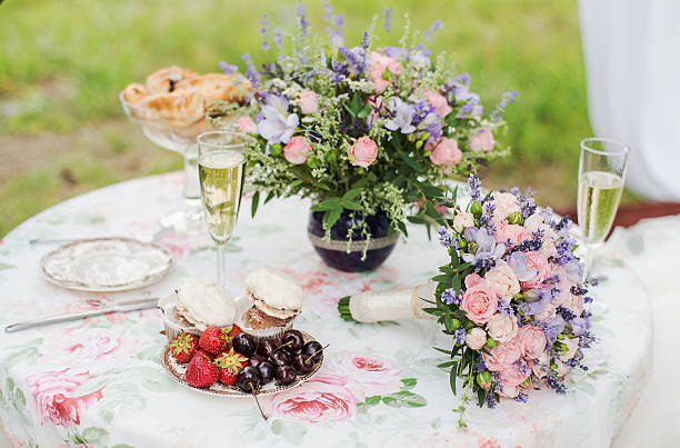 istock Served table outdoors. Flower arrangement with lavender and roses. Wedding 492493548