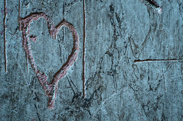 istock heart carved on a wall 492494177